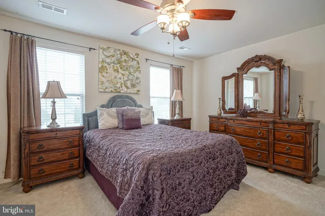 a bedroom with a bed and a large dresser