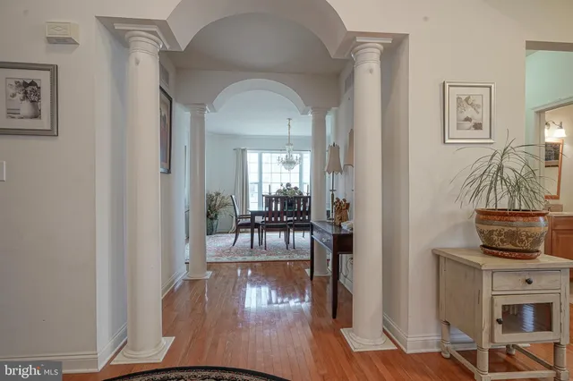 a view of living room and dining room with wooden floor