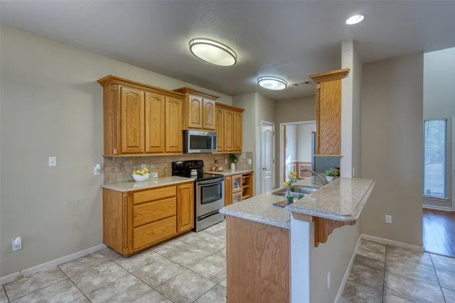 a outdoor living space with furniture and a chandelier