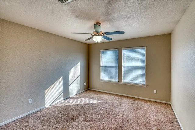 a view of yard with swimming pool and green space