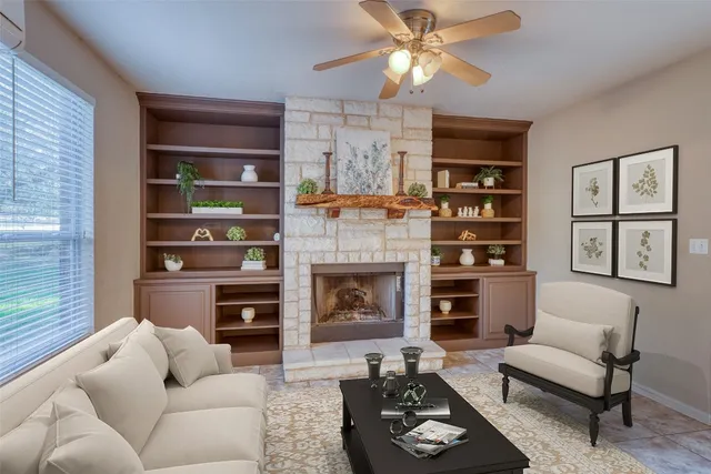 a kitchen with stainless steel appliances granite countertop a sink a stove and a wooden cabinets