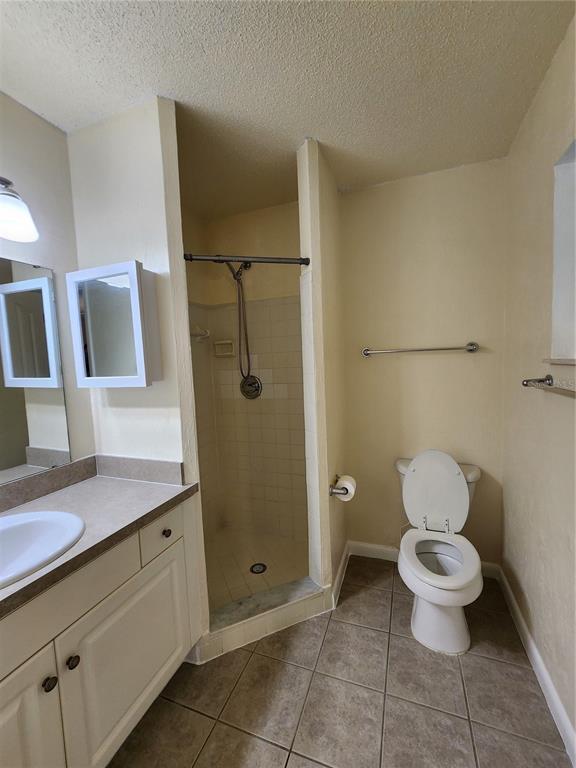 501 Southwest 75th Street, Unit A14 Gainesville, FL 32607 - Photo 38 of 56 a bathroom with a toilet sink and shower