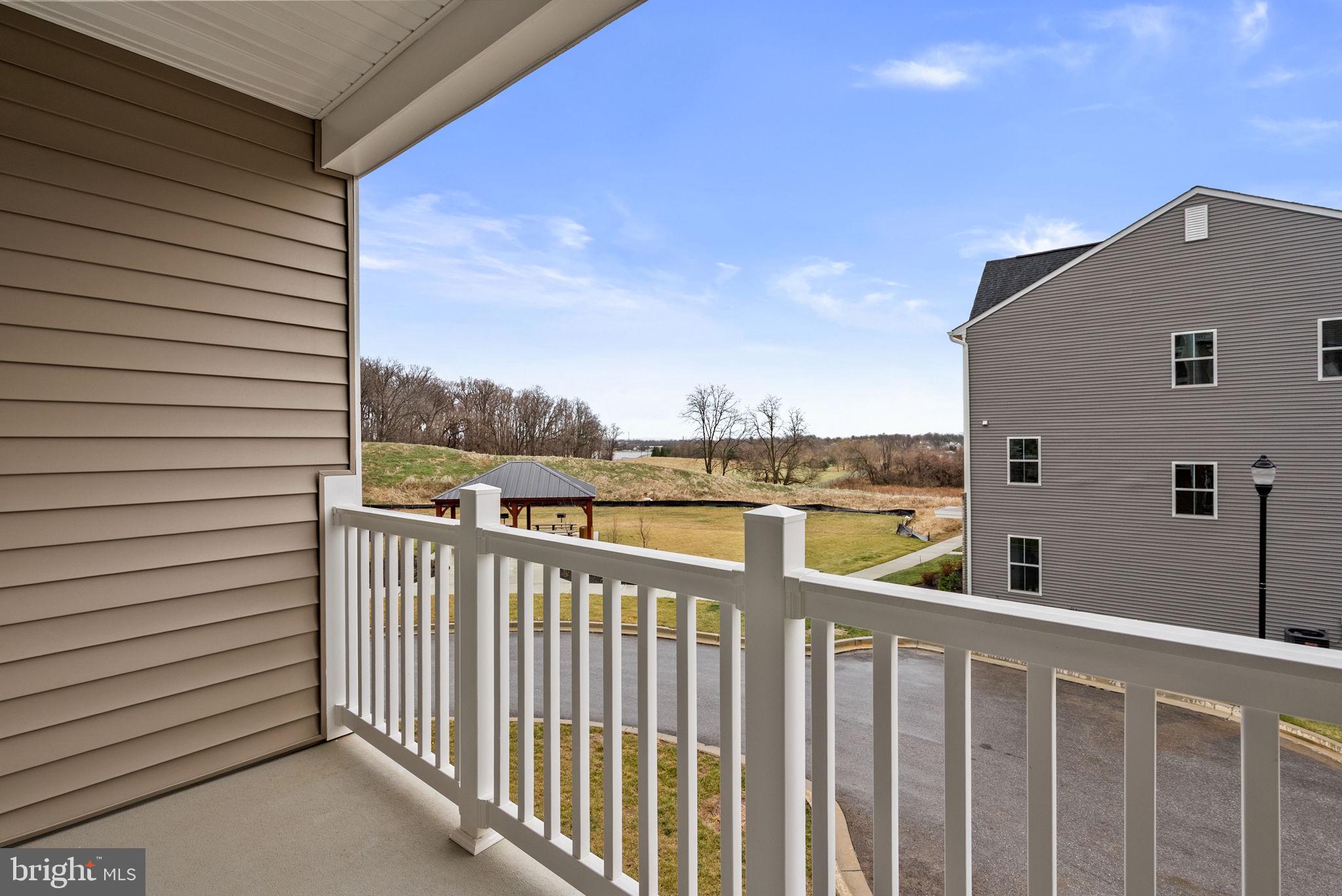 1631 Blacksmith Way, Unit 214B Frederick, MD 21702 - Photo 36 of 41 a view of a balcony with city