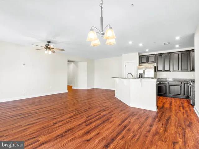 a view of a kitchen with wooden floor