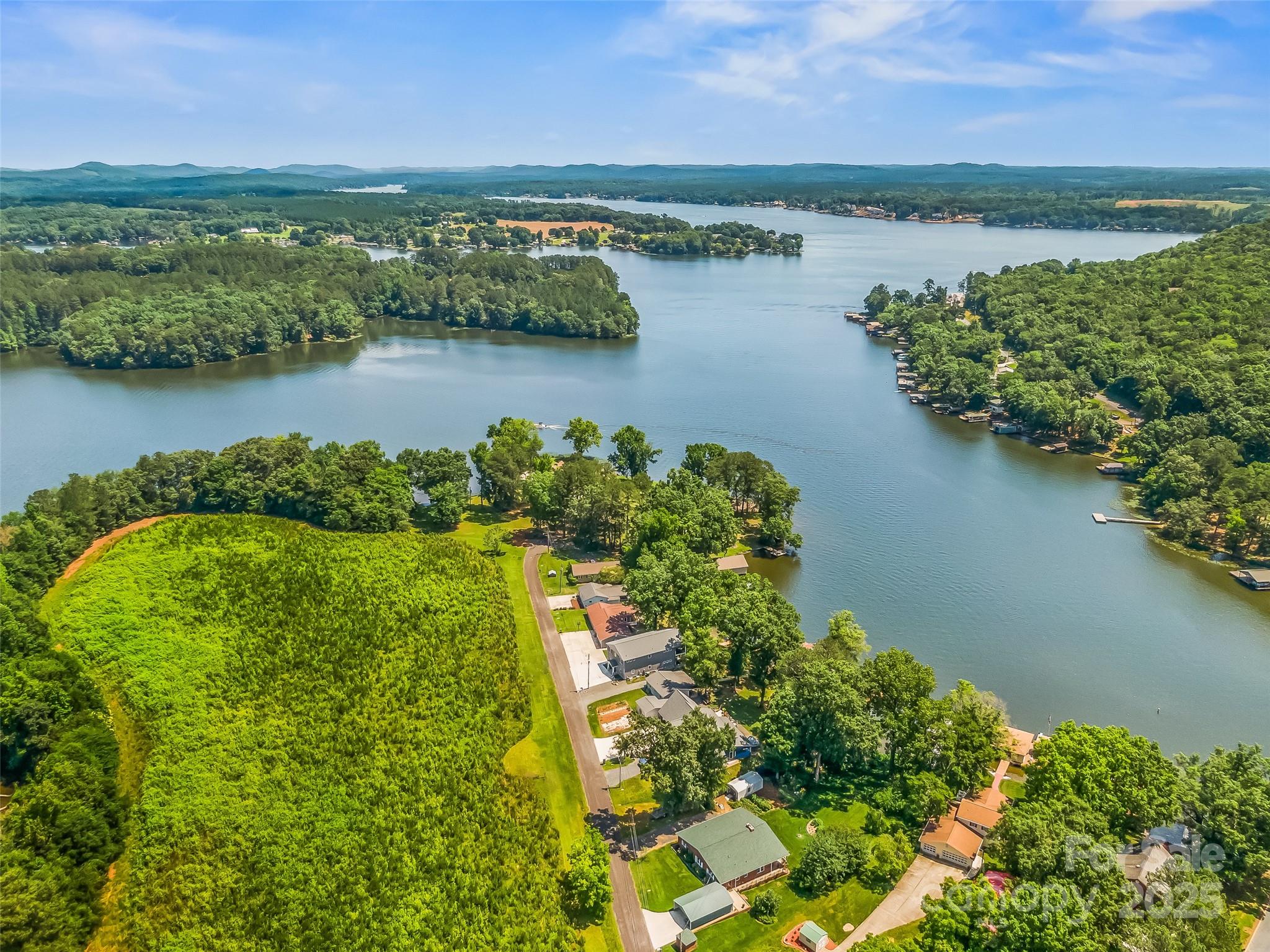 188 Nicks Road, Unit 20/21 Norwood, NC 28128 - Photo 19 of 20 an aerial view of residential houses with outdoor space and lake view