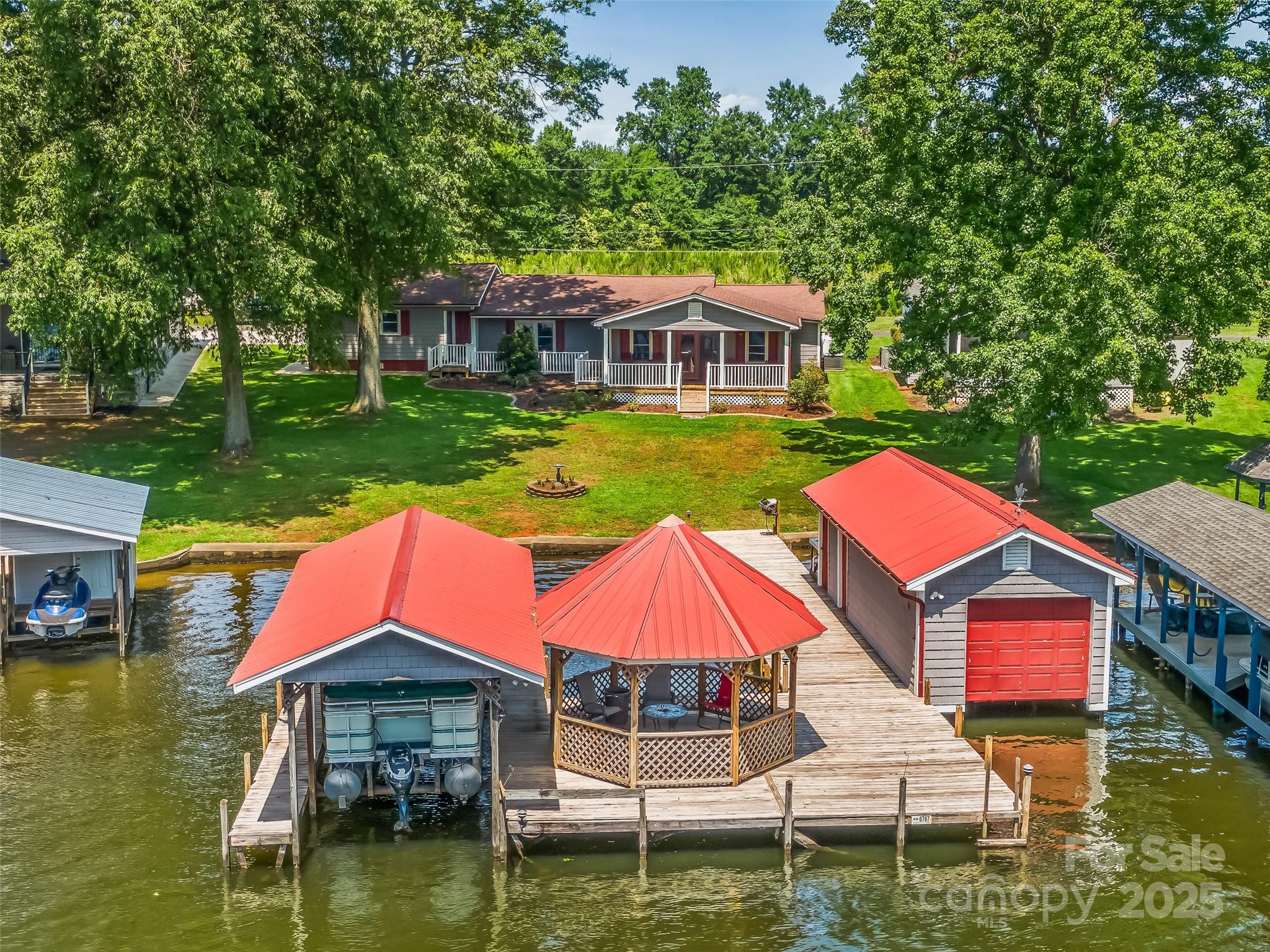 188 Nicks Road, Unit 20/21 Norwood, NC 28128 - Photo 4 of 20 a front view of house with yard and outdoor seating