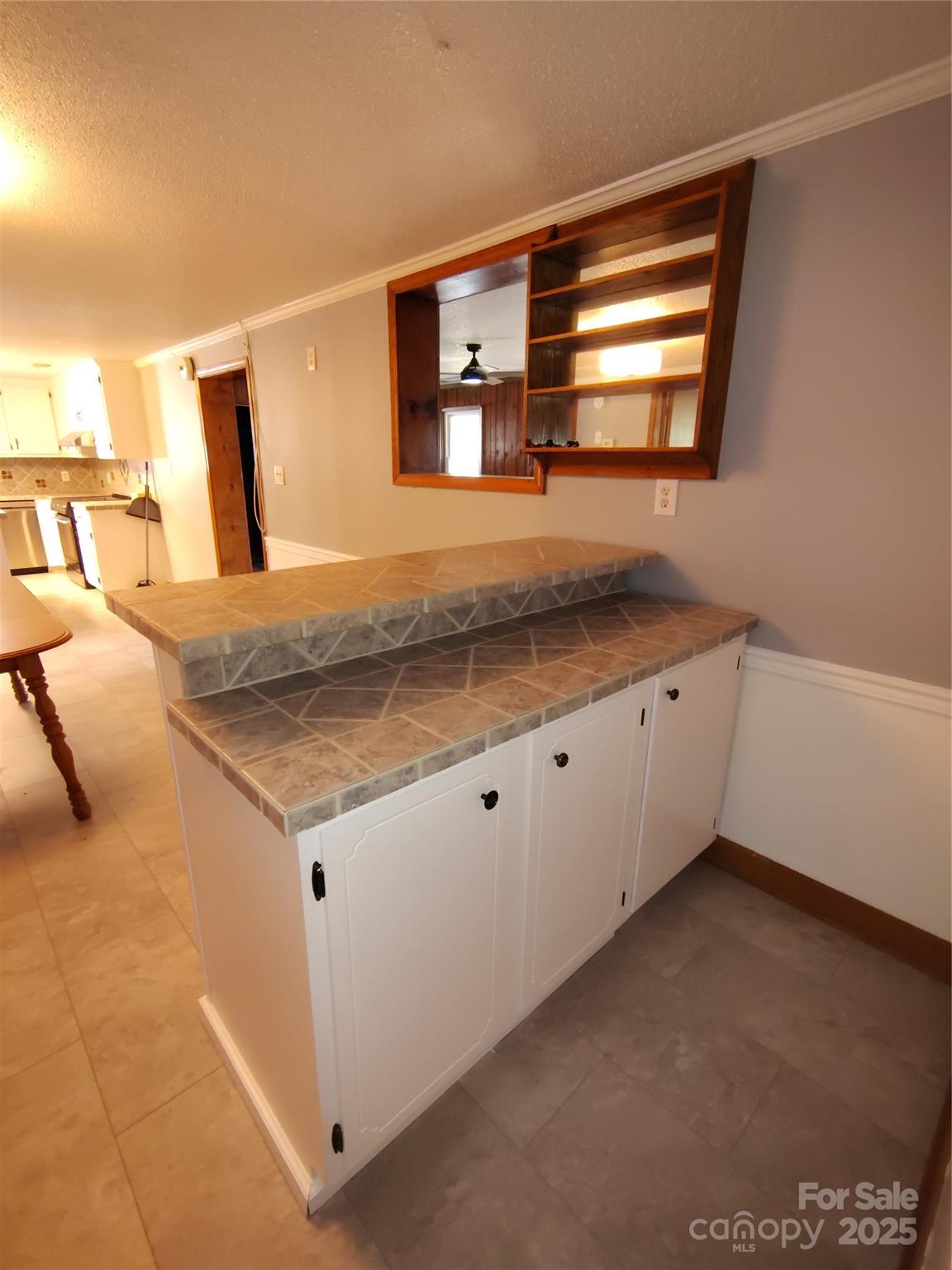 188 Nicks Road, Unit 20/21 Norwood, NC 28128 - Photo 8 of 20 a kitchen with stainless steel appliances granite countertop a sink a stove and a microwave oven