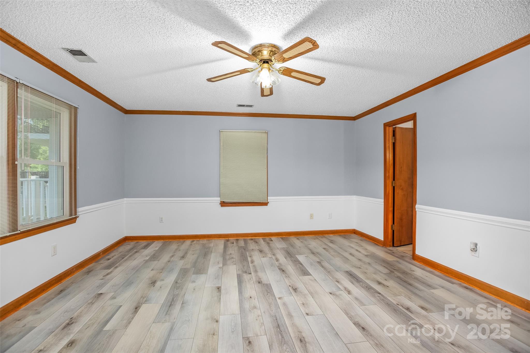 188 Nicks Road, Unit 20/21 Norwood, NC 28128 - Photo 10 of 20 wooden floor in an empty room with a window