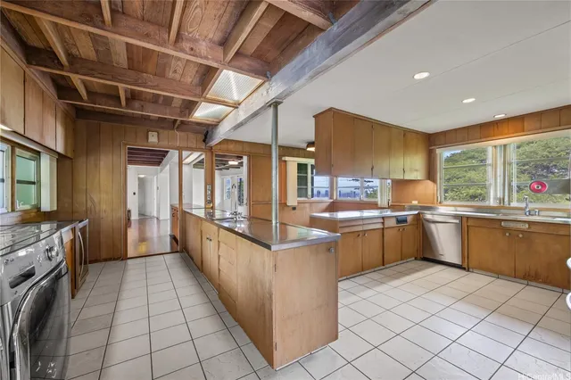 a kitchen with stainless steel appliances lots of counter top space