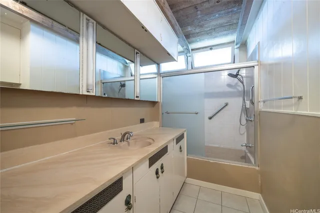 a bathroom with a sink a mirror and a bathtub