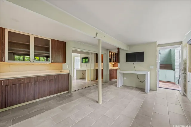 a view of a kitchen with a sink and cabinets