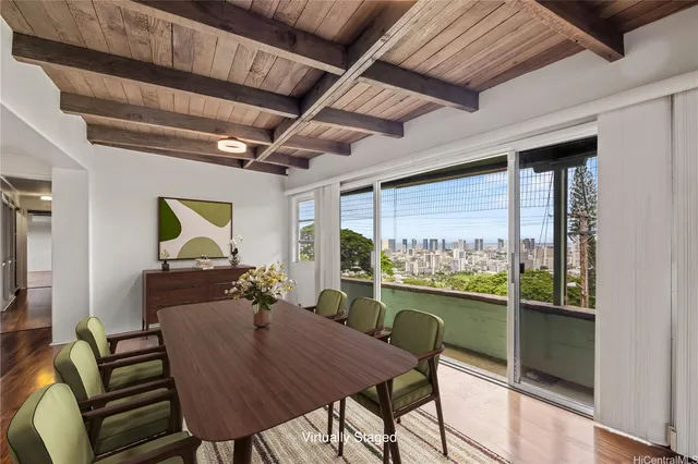 a view of a dining room with furniture window and outside view