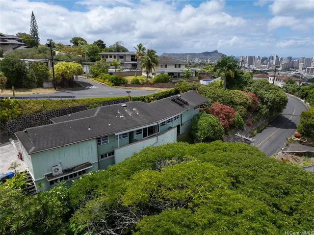 an aerial view of a house with a garden