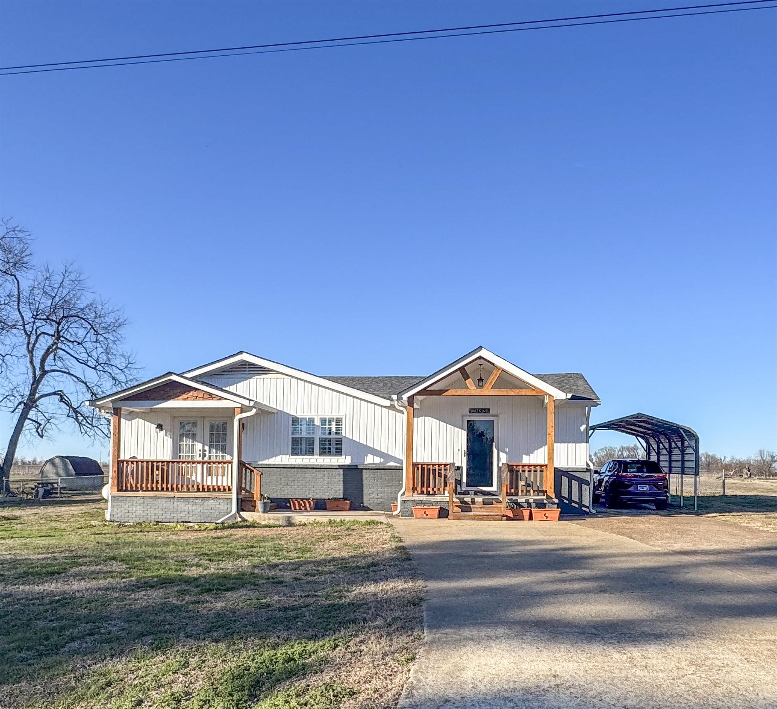 a front view of residential houses with yard