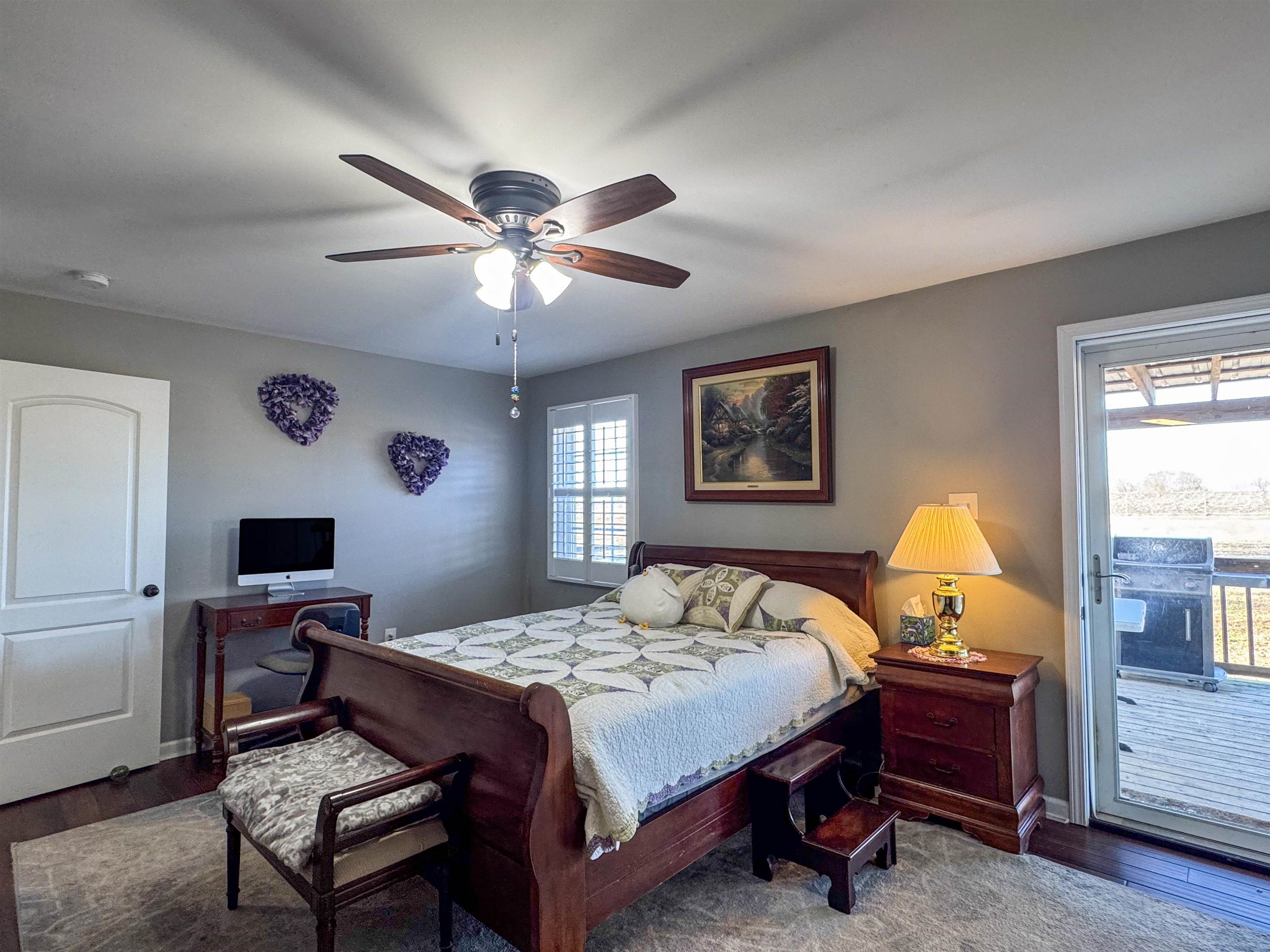 792 Smith Drive Covington, TN 38019 - Photo 22 of 34 a bedroom with a bed and a chandelier