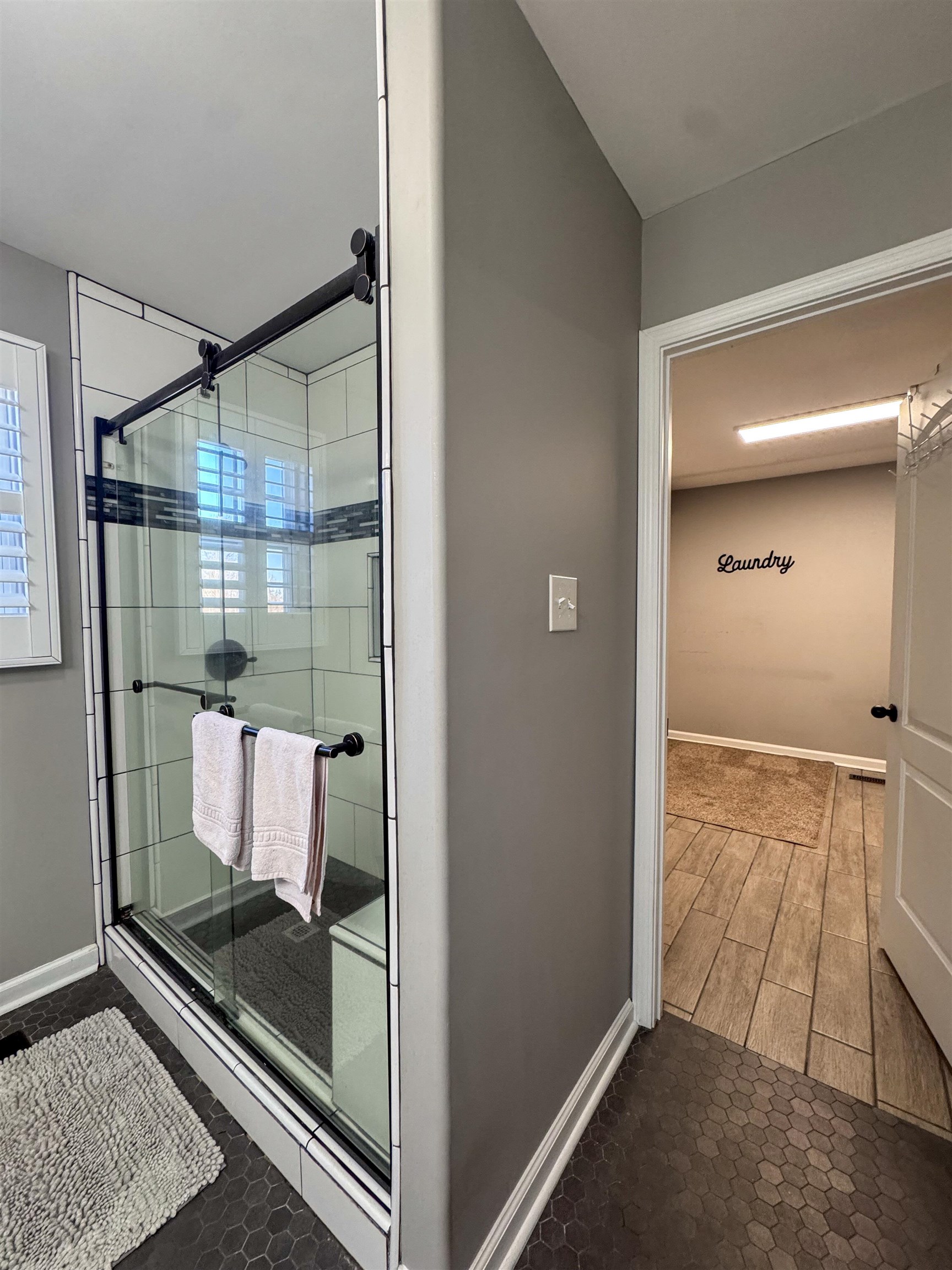 792 Smith Drive Covington, TN 38019 - Photo 25 of 34 Full bathroom featuring a shower stall and dark tile patterned flooring