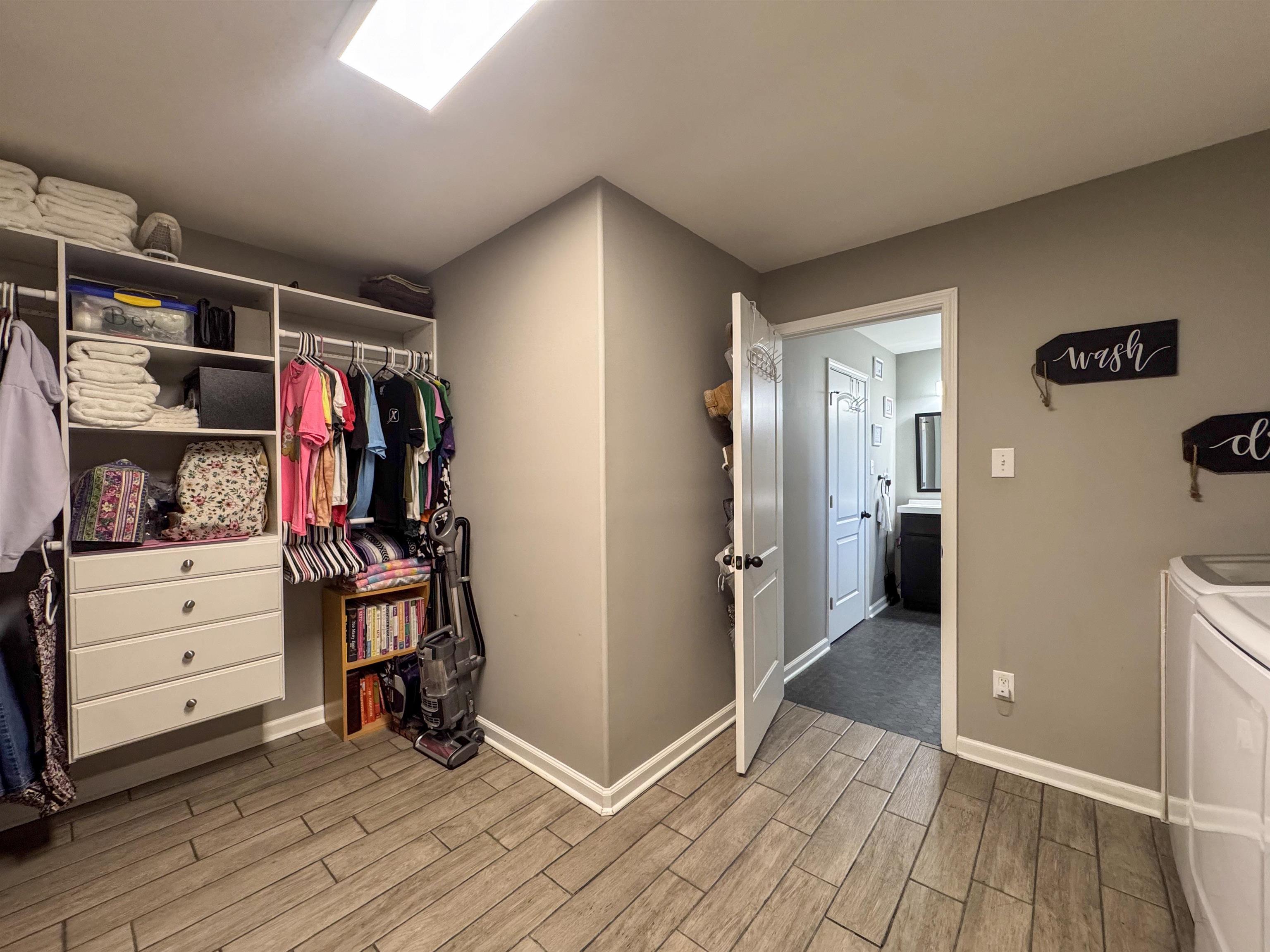 792 Smith Drive Covington, TN 38019 - Photo 26 of 34 a view of walk in closet with clothes and shoes