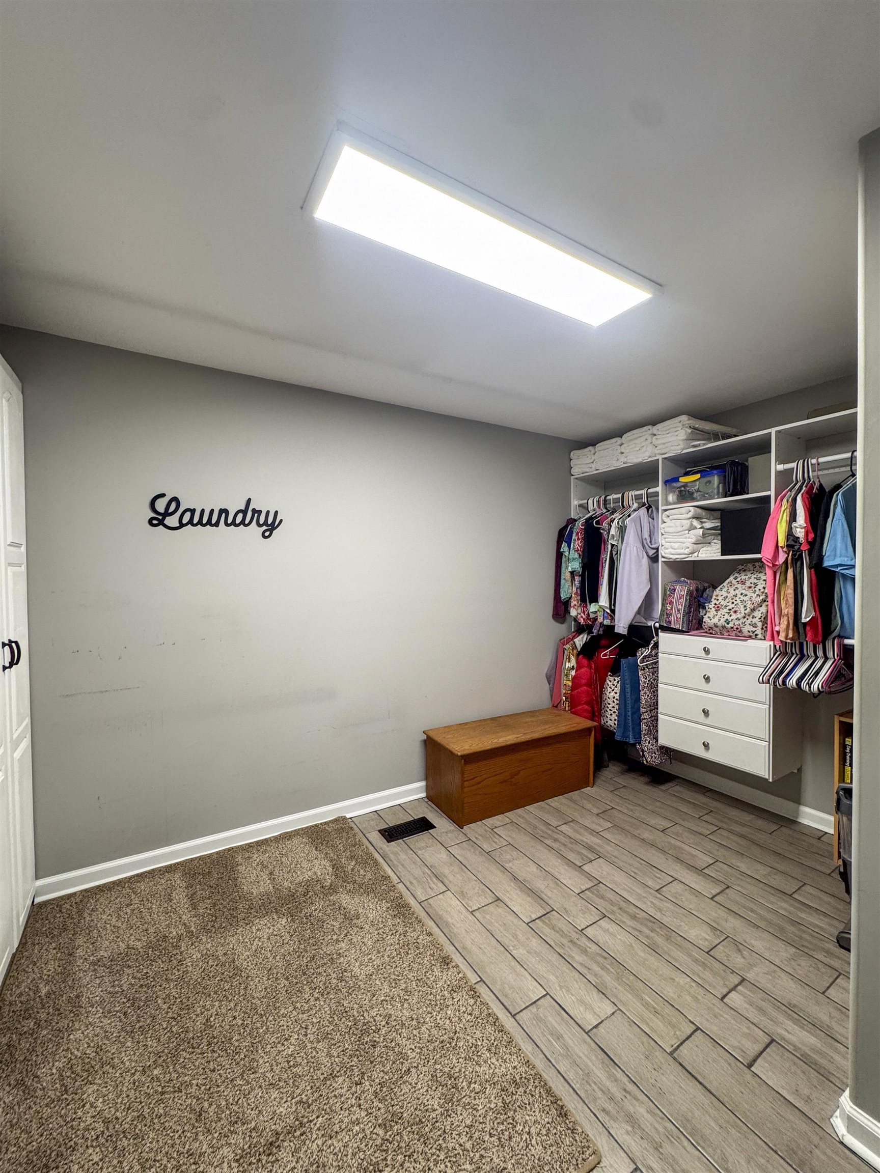 792 Smith Drive Covington, TN 38019 - Photo 28 of 34 Walk in closet with wood finish floors