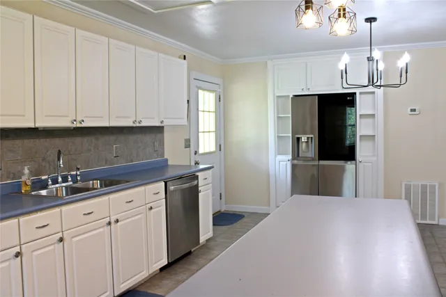 a view of kitchen with wooden floor