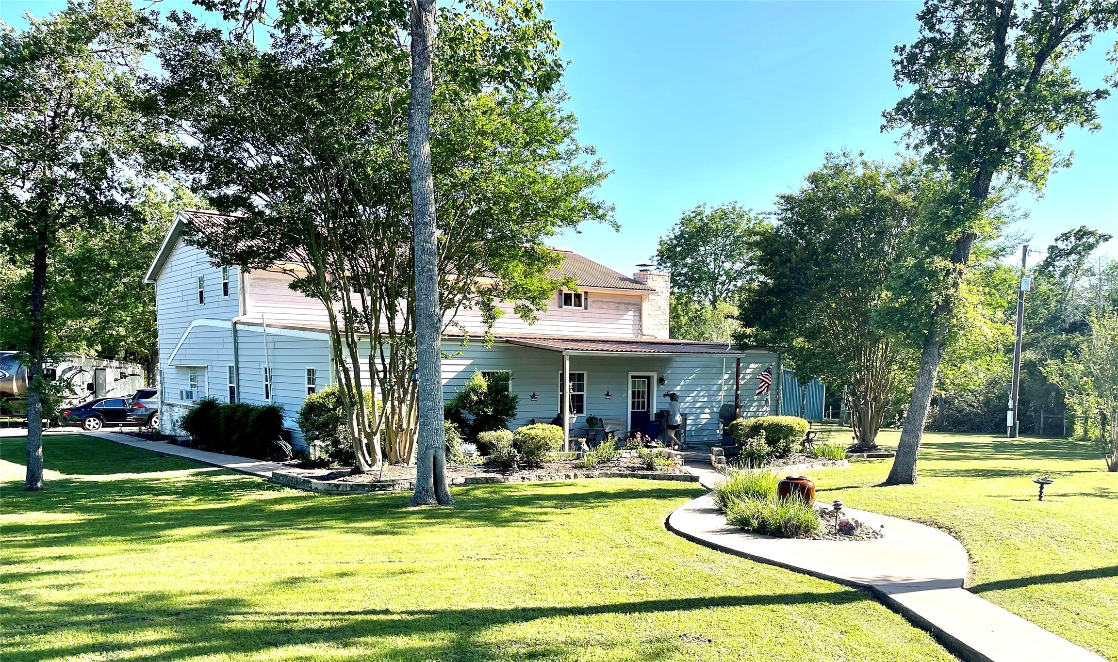2042 Willow Springs Road Fayetteville, TX 78940 - Photo 41 of 42 a view of a swimming pool with couches chairs and a big yard