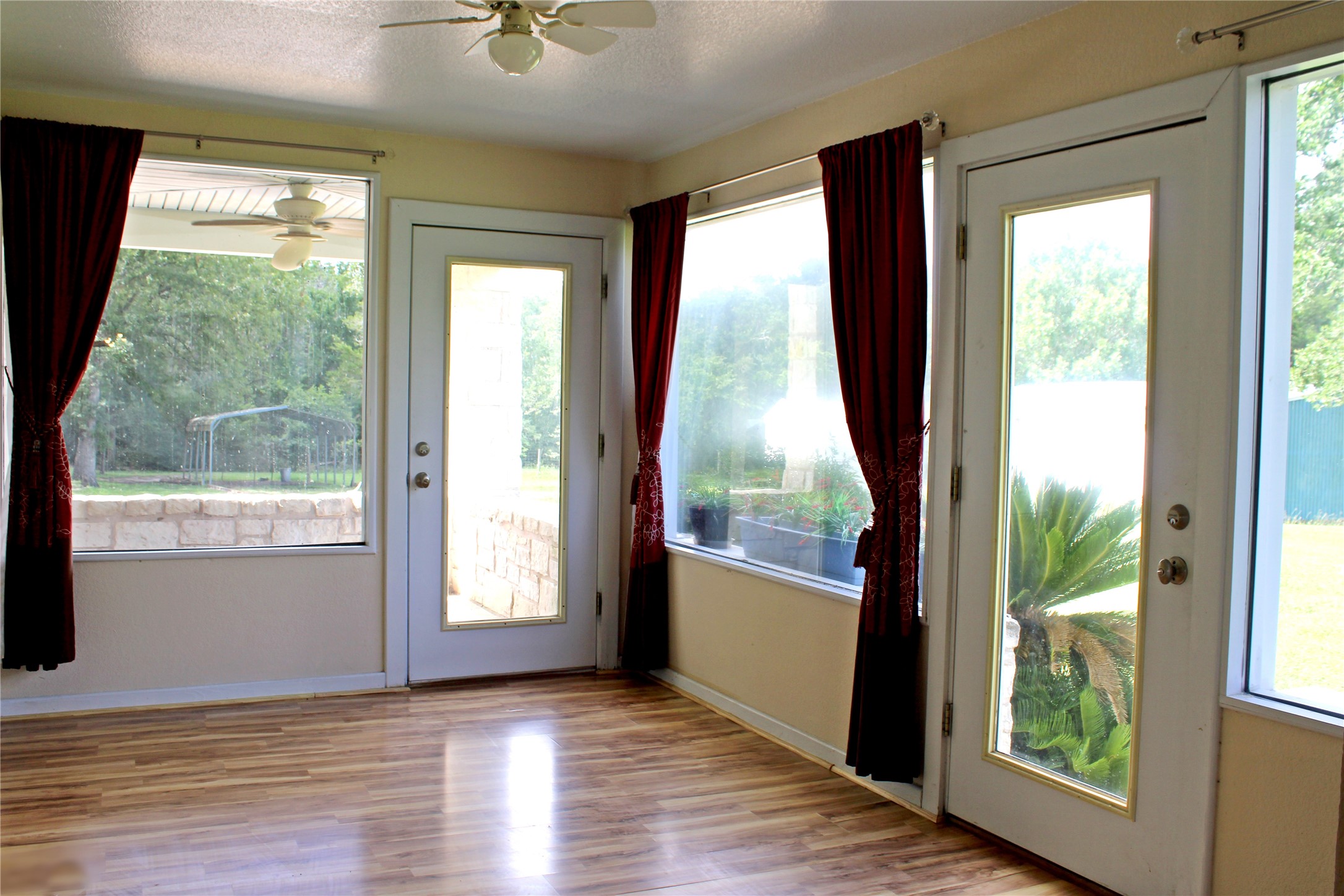 2042 Willow Springs Road Fayetteville, TX 78940 - Photo 6 of 42 a view of an empty room with wooden floor and a window