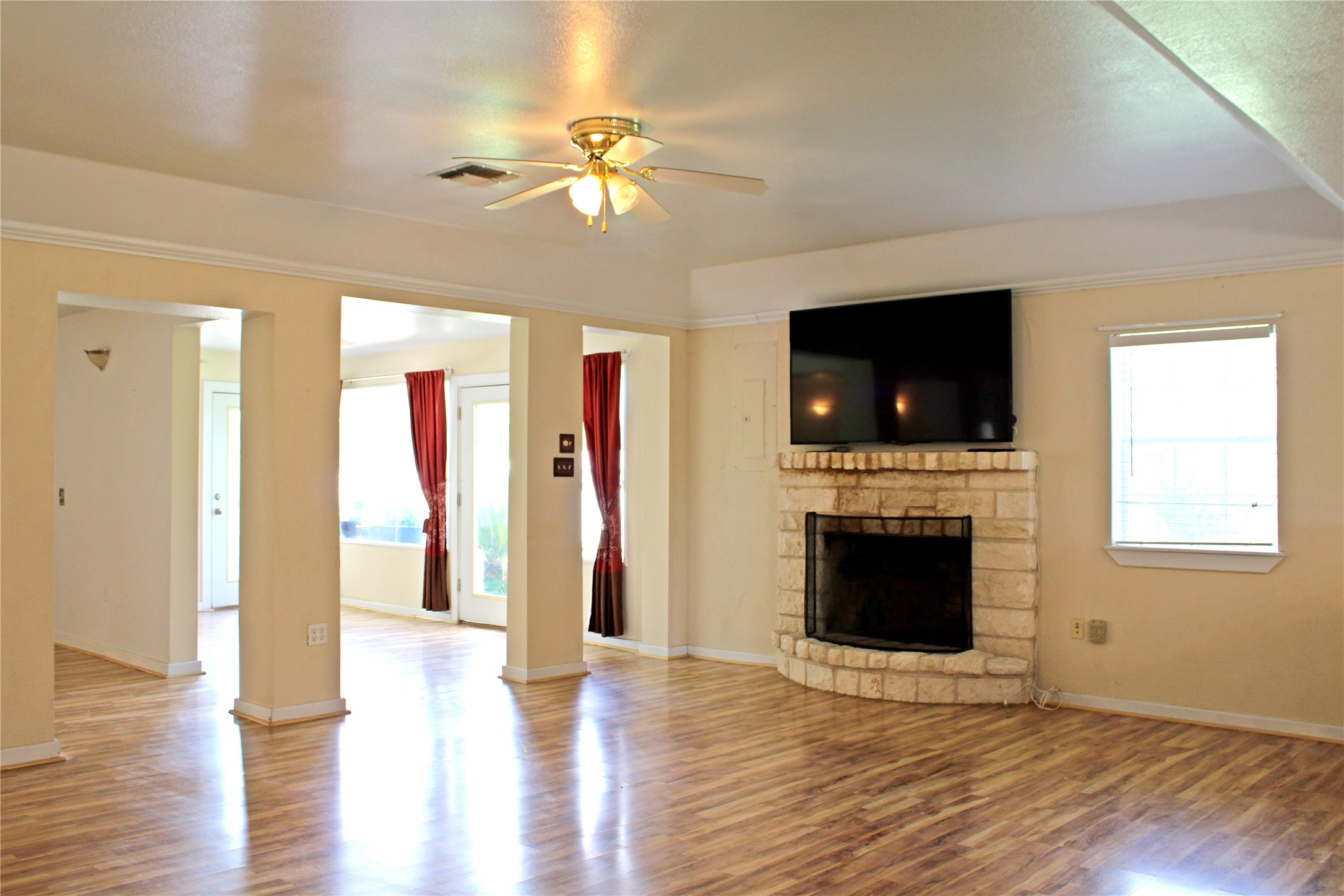 2042 Willow Springs Road Fayetteville, TX 78940 - Photo 8 of 42 a view of a livingroom with wooden floor and a fireplace