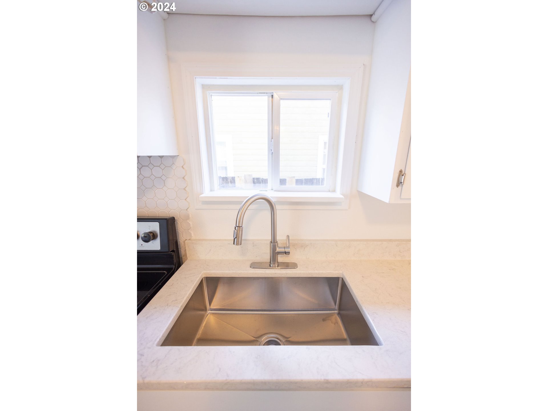 440 Wilkie Street Eugene, OR 97402 - Photo 15 of 38 a kitchen with a sink and a window