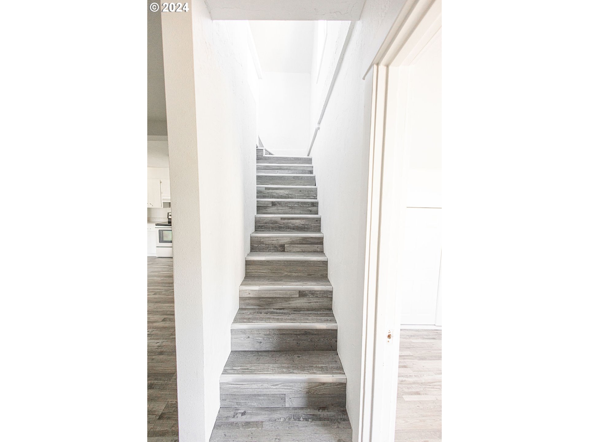 440 Wilkie Street Eugene, OR 97402 - Photo 24 of 38 a view of staircase with white walls and a window