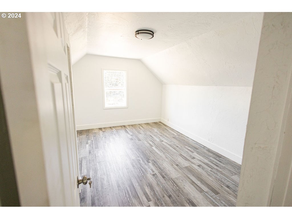 440 Wilkie Street Eugene, OR 97402 - Photo 25 of 38 a view of an empty room and wooden floor