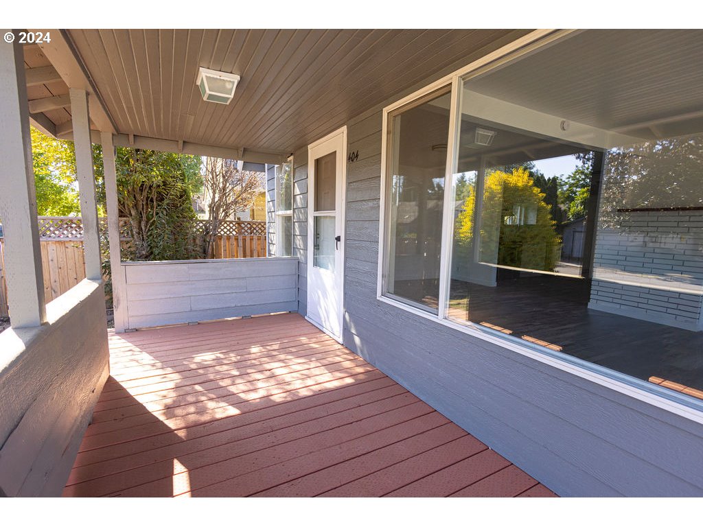 440 Wilkie Street Eugene, OR 97402 - Photo 7 of 38 a view of backyard with floor to ceiling window and wooden floor