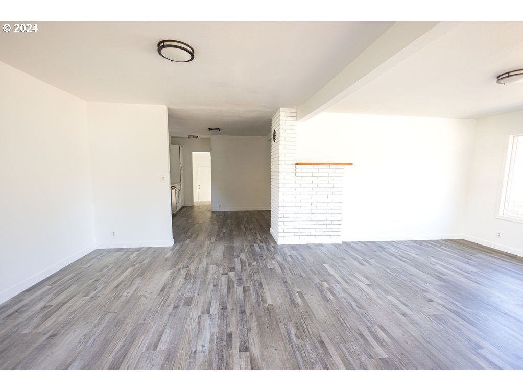 440 Wilkie Street Eugene, OR 97402 - Photo 8 of 38 a view of an empty room with wooden floor