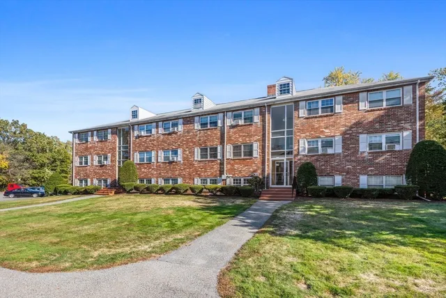 a view of a building with a yard