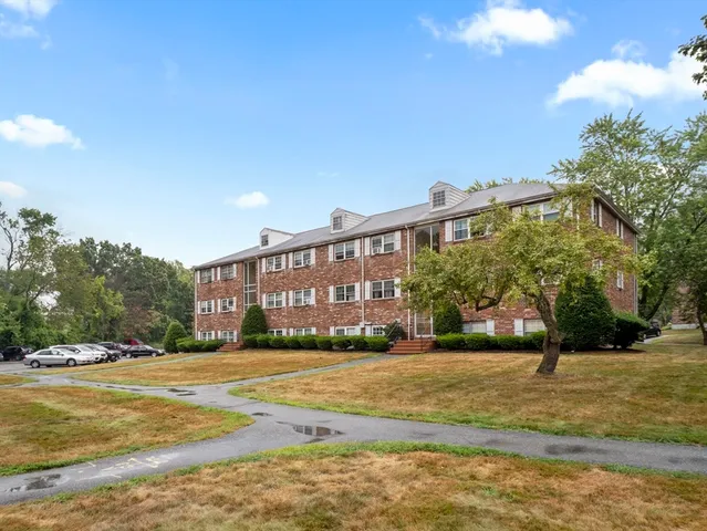 a view of a building with a yard