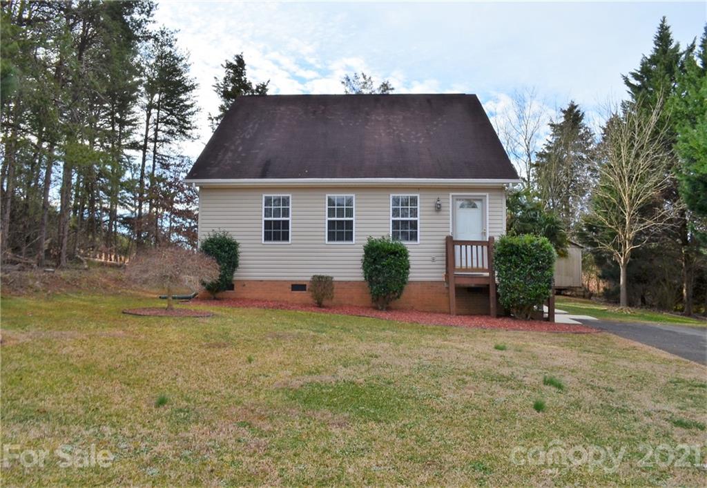 7610 Sarah Drive Denver, NC 28037 - Photo 1 of 48 a front view of house with yard and trees in the background
