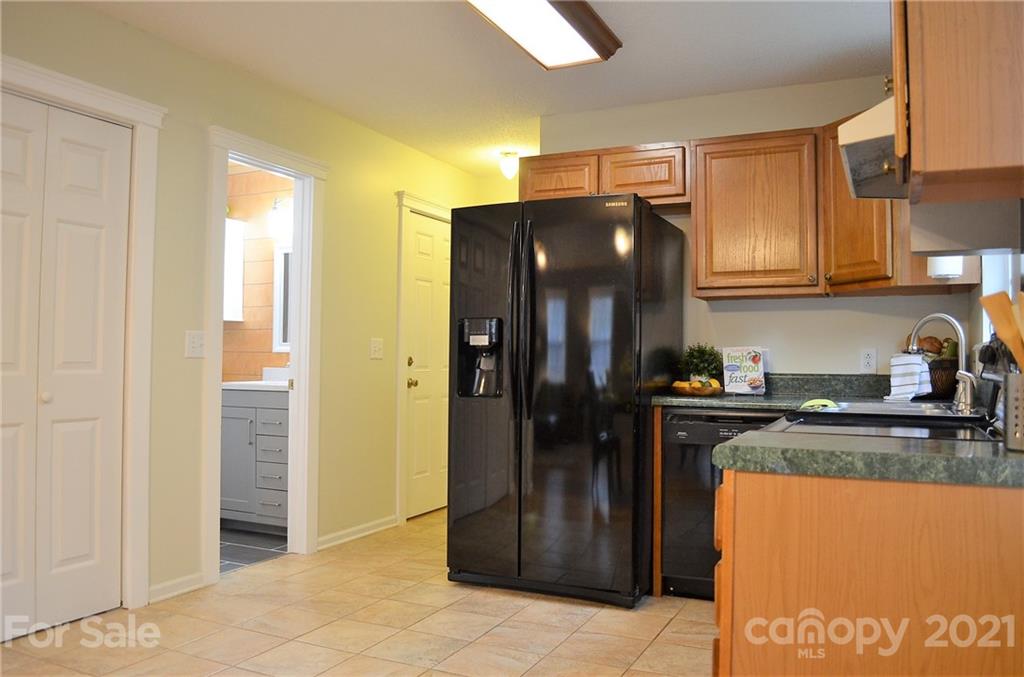 7610 Sarah Drive Denver, NC 28037 - Photo 13 of 48 a kitchen with stainless steel appliances granite countertop a refrigerator and a stove