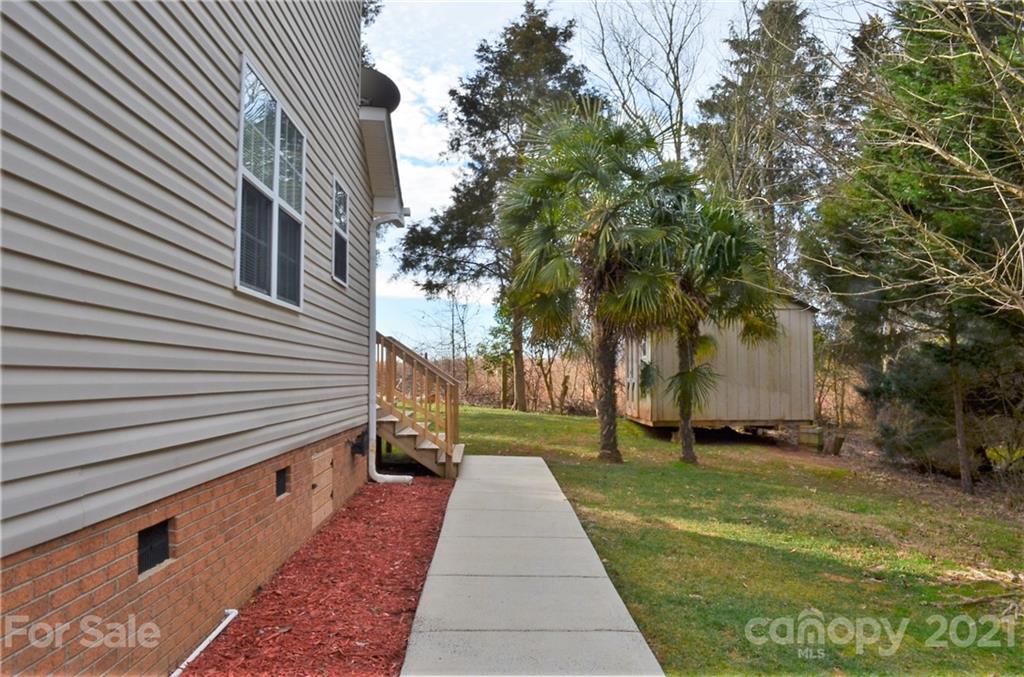 7610 Sarah Drive Denver, NC 28037 - Photo 3 of 48 a pathway of a house with a yard