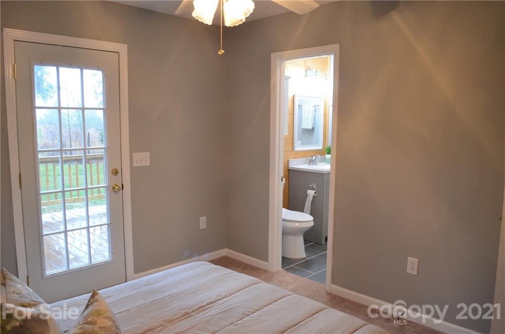 7610 Sarah Drive Denver, NC 28037 - Photo 24 of 48 a bedroom with a bed and a window