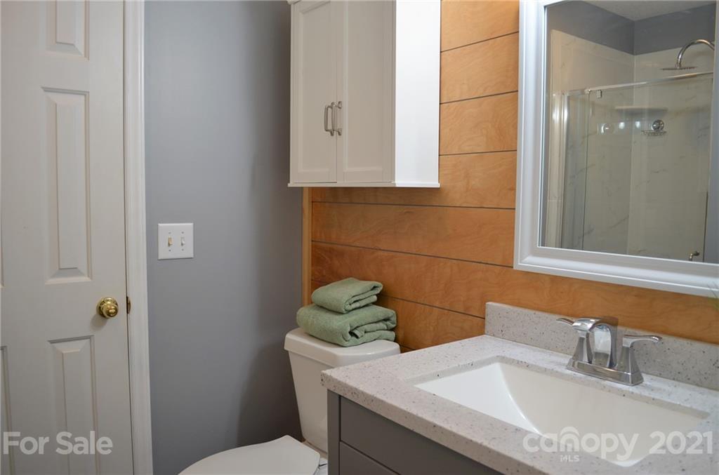 7610 Sarah Drive Denver, NC 28037 - Photo 26 of 48 a bathroom with a sink toilet and vanity