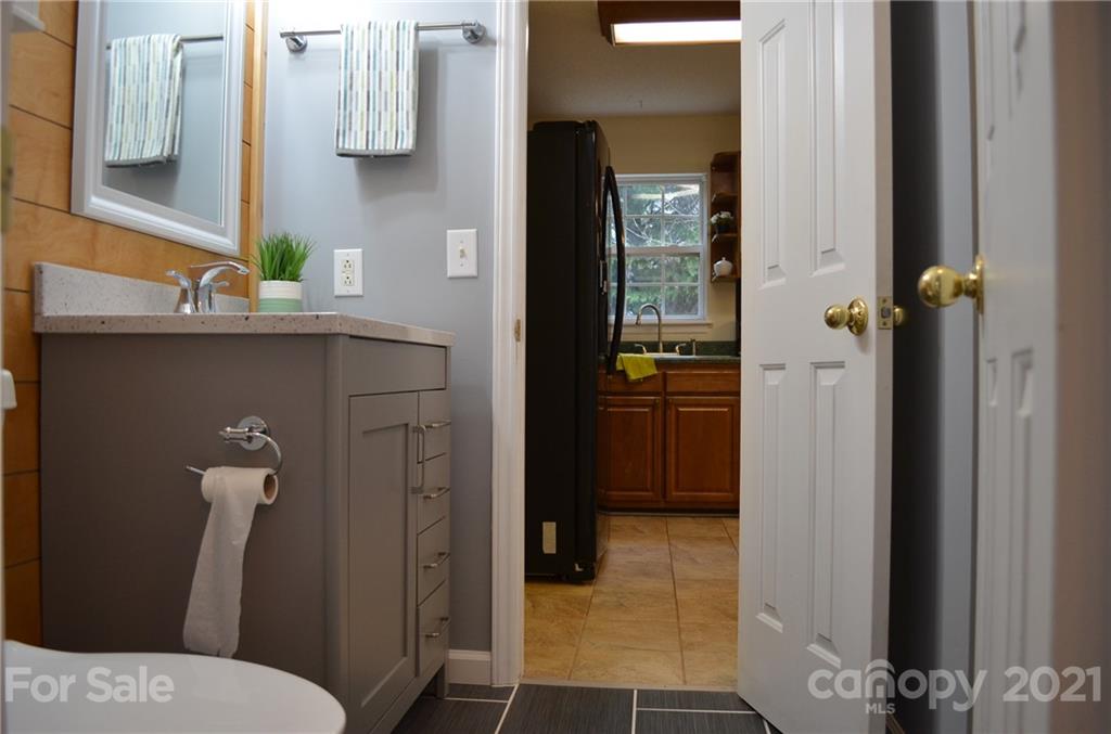 7610 Sarah Drive Denver, NC 28037 - Photo 28 of 48 a bathroom with a sink and toilet