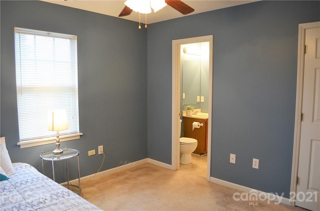 7610 Sarah Drive Denver, NC 28037 - Photo 33 of 48 a bedroom with a bed and a dresser