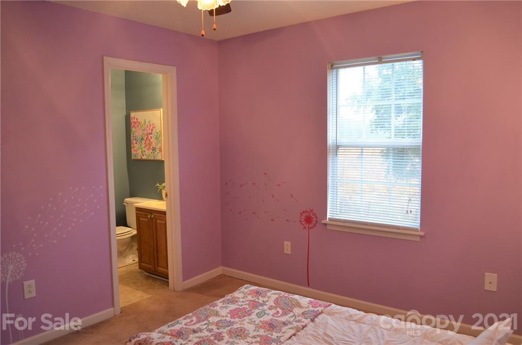 7610 Sarah Drive Denver, NC 28037 - Photo 38 of 48 a bedroom with a bed and a window