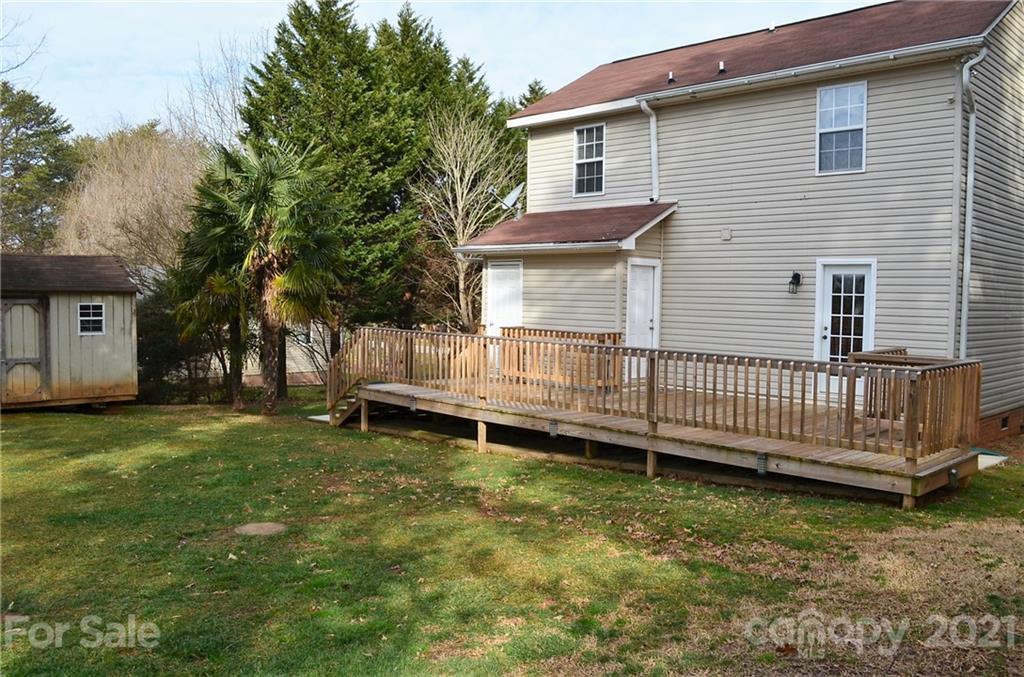 7610 Sarah Drive Denver, NC 28037 - Photo 45 of 48 a front view of a house with a garden