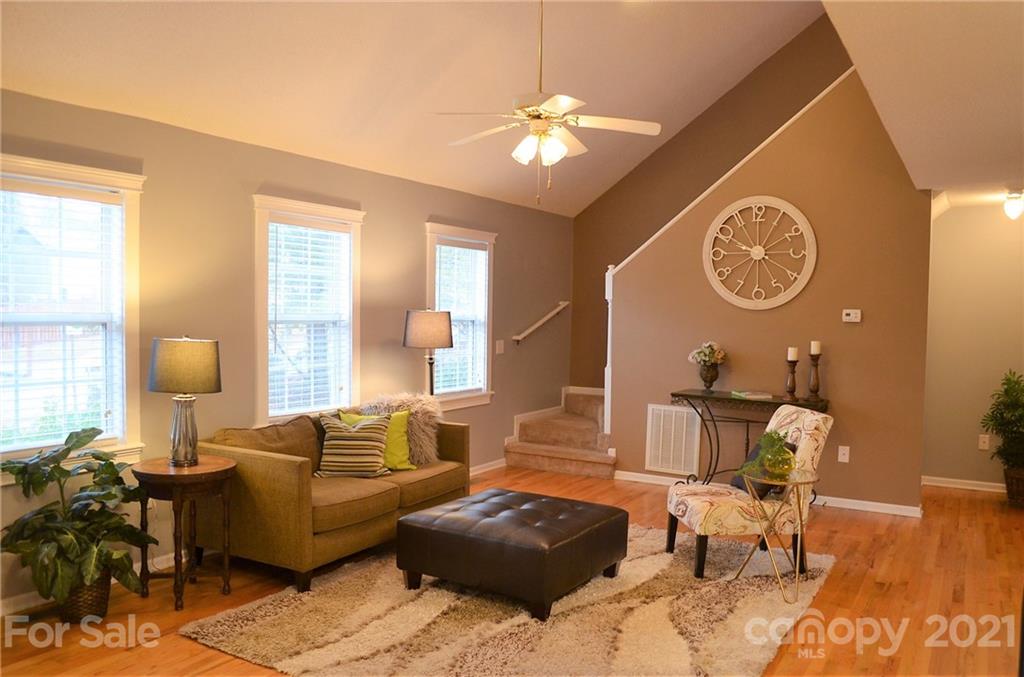 7610 Sarah Drive Denver, NC 28037 - Photo 7 of 48 a living room with furniture and a lamp