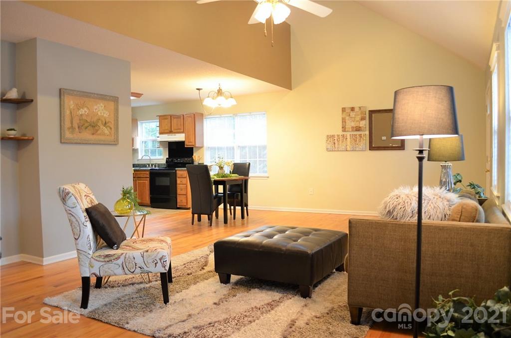 7610 Sarah Drive Denver, NC 28037 - Photo 9 of 48 a living room with furniture and a lamp