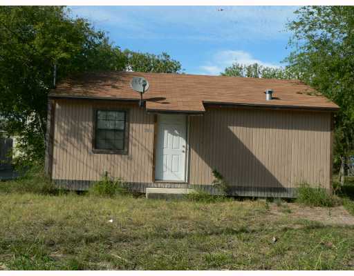 a view of a barn in the back yard