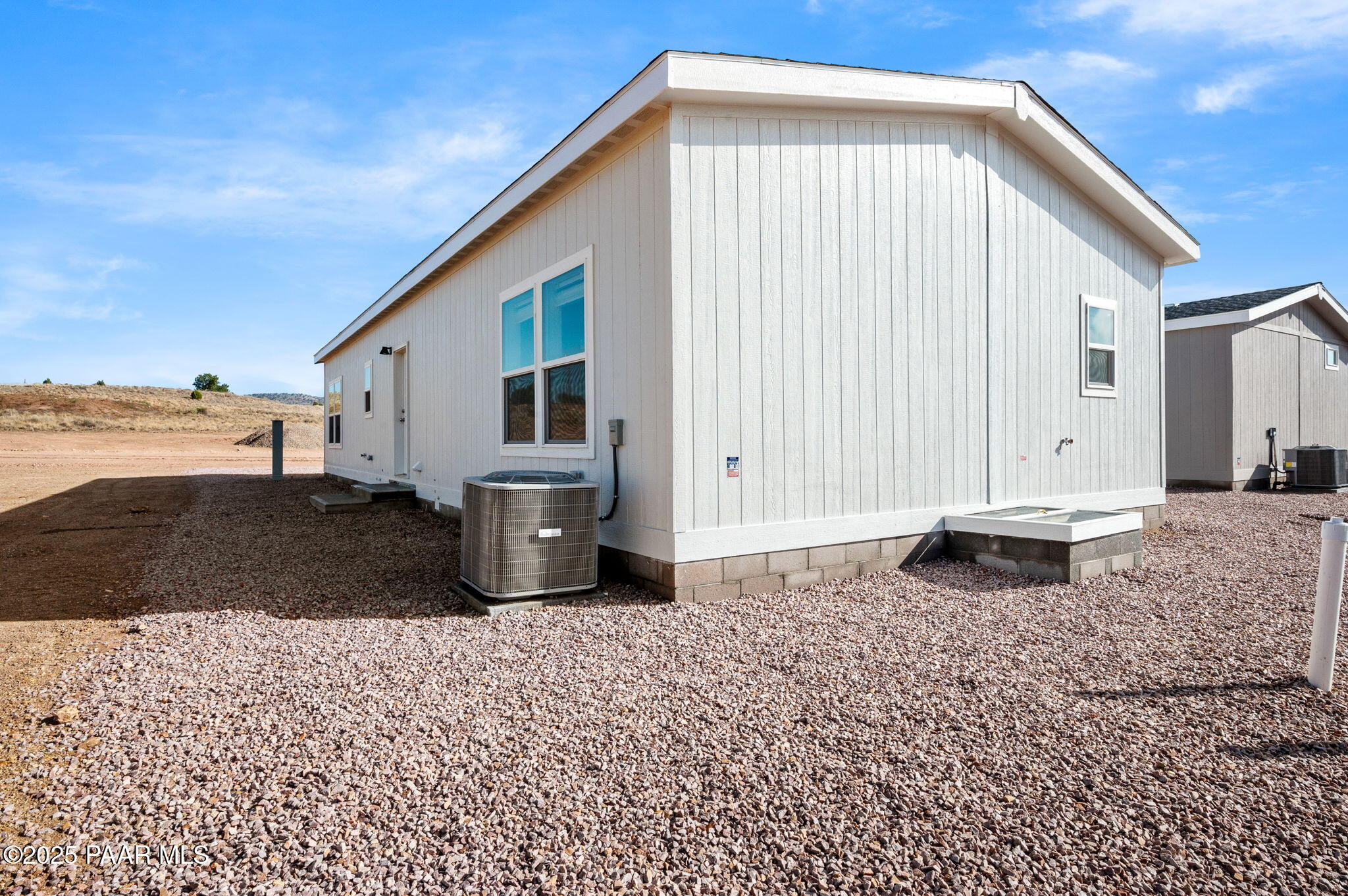 29 East Abra Road Paulden, AZ 86334 - Photo 21 of 22 a front view of a house with a yard