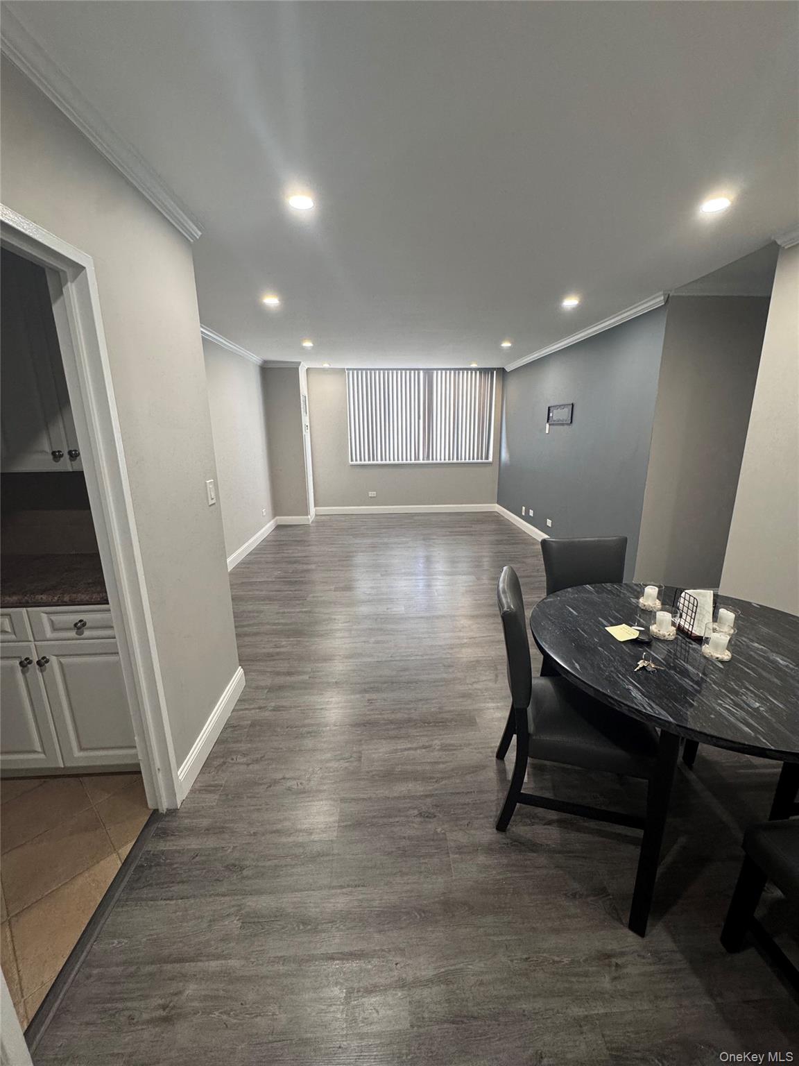 269 Grand Central Parkway, Unit 2C Queens, NY 11005 - Photo 3 of 18 Dining room open ,featuring crown molding, recessed lighting, and dark wood-type flooring