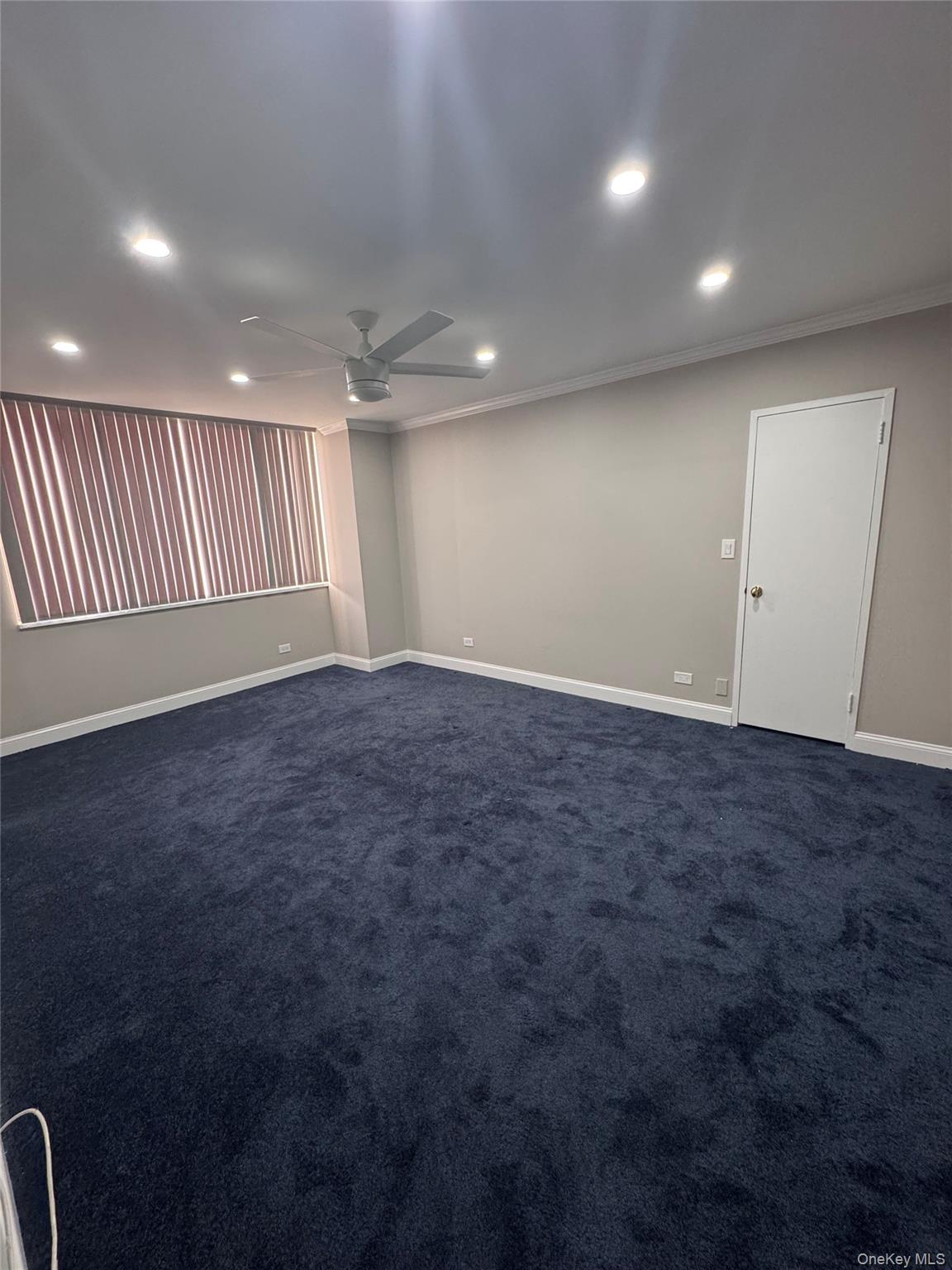269 Grand Central Parkway, Unit 2C Queens, NY 11005 - Photo 6 of 18 Empty bedroom featuring recessed lighting, dark colored carpet, crown molding, and ceiling fan