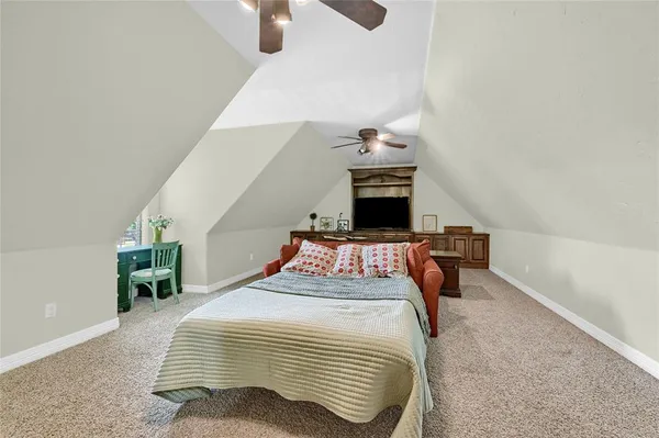 a bedroom with a bed and cabinets