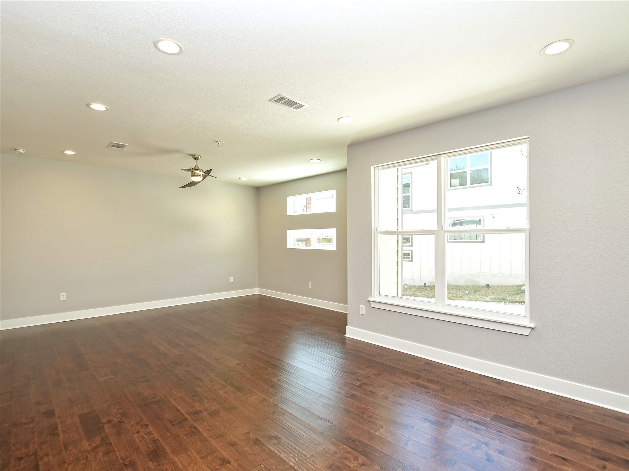 1130 Lott Avenue, Unit B Austin, TX 78721 - Photo 8 of 29 Spare room featuring dark wood-type flooring, recessed lighting, and a ceiling fan